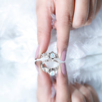 Ethiopian opal flower engagement ring with real diamond set in a silver band, featuring vibrant opal and sparkling diamond accents.