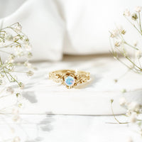 Genuine Ethiopian Opal flower engagement ring by Rosec Jewels with a sparkling real diamond accent, showcasing intricate floral design.