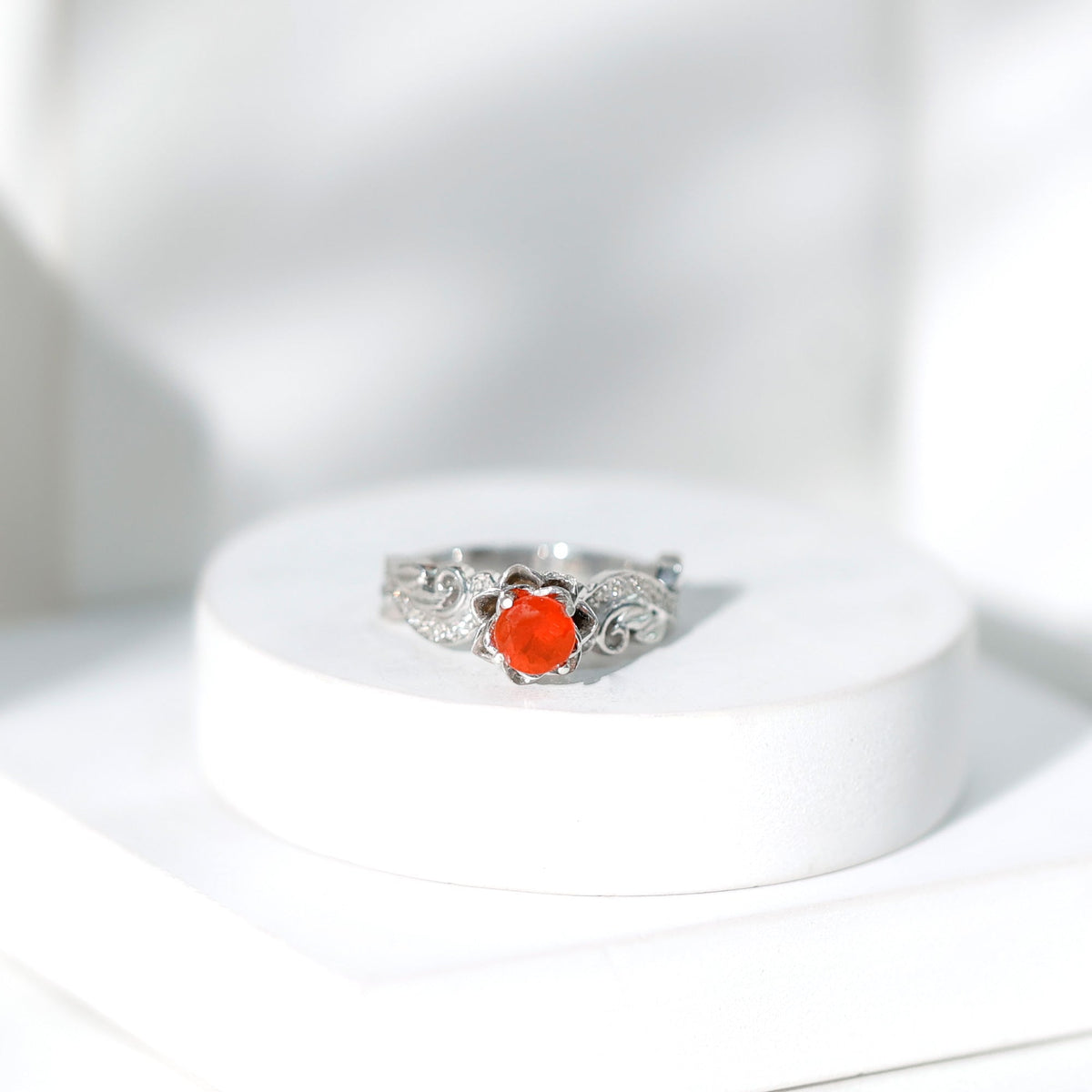Nature-inspired fire opal and diamond engagement ring by Rosec Jewels featuring intricate design and sparkling gemstones.