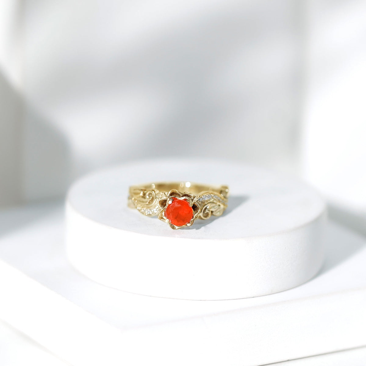 Nature-inspired Fire Opal and Diamond engagement ring from Rosec Jewels featuring intricate detailing and a vibrant orange gemstone.