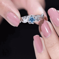 Round 0.6 carat London Blue Topaz engagement ring with diamond accents, nature-inspired design, by Rosec Jewels.