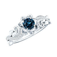 Round 0.6 carat London Blue Topaz engagement ring with diamond accents, nature-inspired design by Rosec Jewels.