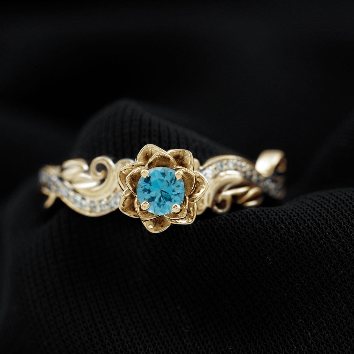 Rosec Jewels 0.6 Carat London Blue Topaz engagement ring with round shape blue topaz and diamond accents, nature-inspired design.