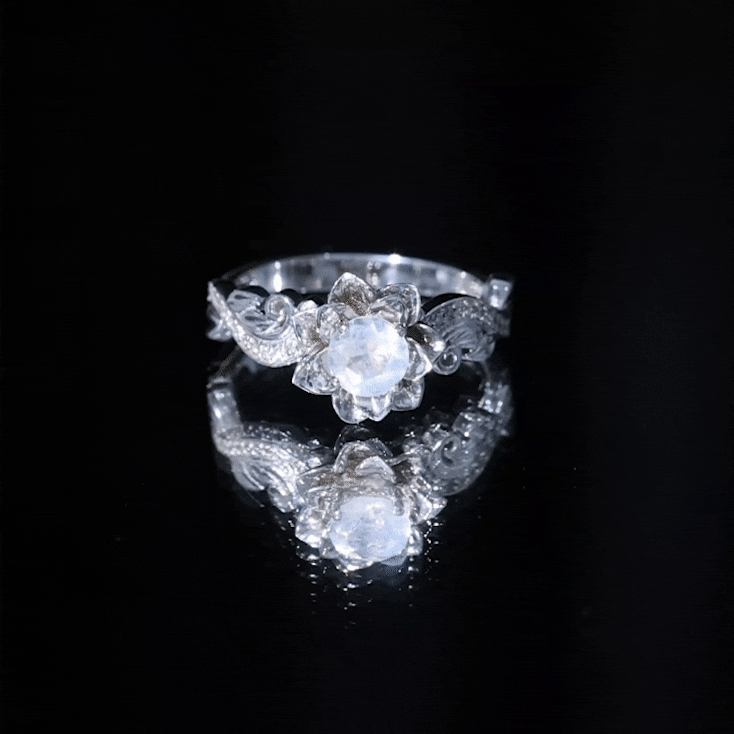 Natural moonstone rose flower engagement ring with diamond accents, crafted by Rosec Jewels, showcasing a delicate floral design.