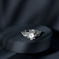 Natural moonstone rose flower engagement ring with diamond accents from Rosec Jewels, featuring intricate floral design and sparkling gemstones.
