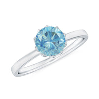 Round cut aquamarine solitaire engagement ring with a 0.8 carat aquamarine gemstone set in a silver band, by Rosec Jewels.