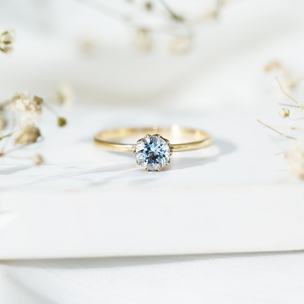 0.8 carat round cut aquamarine solitaire engagement ring by Rosec Jewels, featuring a sparkling aquamarine gemstone on a sleek band.