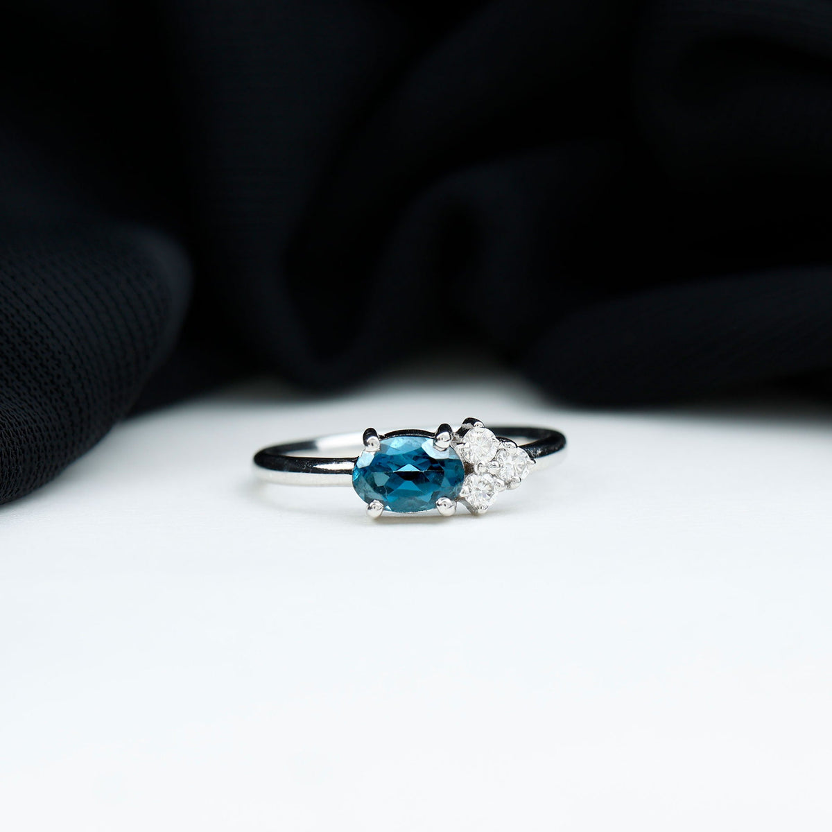 0.4 Carat Oval Cut London Blue Topaz East West Promise Ring with Diamond Trio