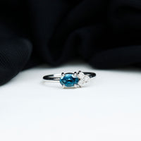 0.4 Carat Oval Cut London Blue Topaz East West Promise Ring with Diamond Trio