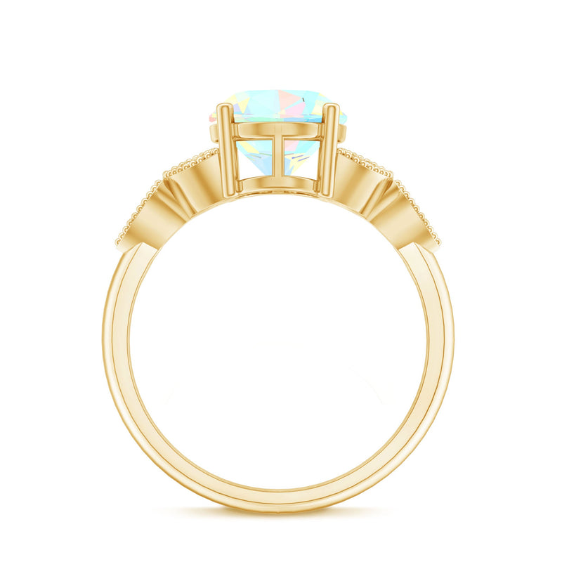 Vintage style Ethiopian opal engagement ring with diamond, featuring an oblong shape and intricate design by Rosec Jewels.