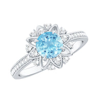 Genuine aquamarine floral engagement ring with diamond side stones, featuring detailed metalwork and elegant design.