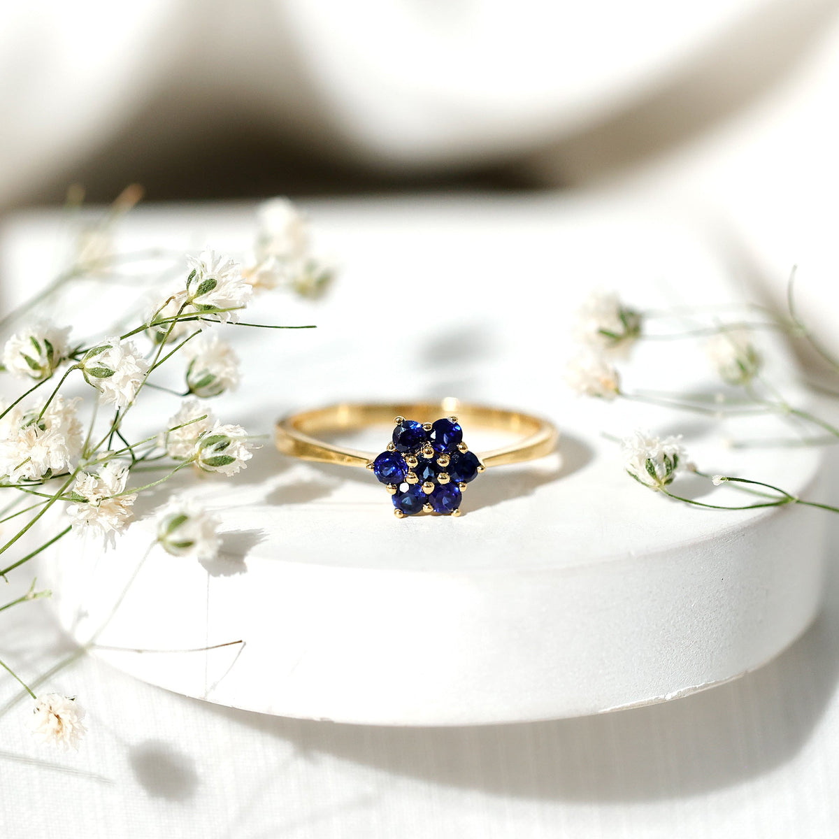 Certified round shape blue sapphire cluster flower ring by Rosec Jewels, featuring a floral design with vibrant blue sapphires.