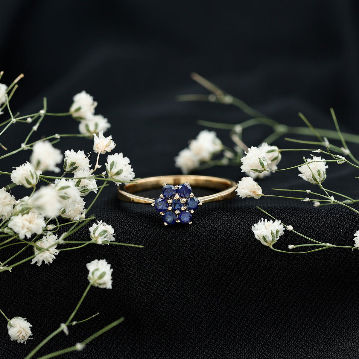Round shape blue sapphire cluster flower ring by Rosec Jewels featuring a floral design with sparkling blue sapphires.