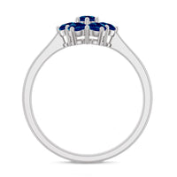 Rosec Jewels London Blue Topaz flower engagement ring featuring a large blue topaz gemstone and intricate floral design.