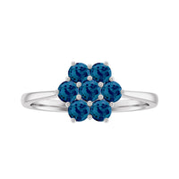 Rosec Jewels London Blue Topaz flower engagement ring with certificate, showcasing a detailed gemstone and elegant silver band.