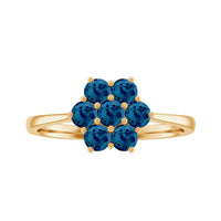 Rosec Jewels London Blue Topaz flower engagement ring featuring a large blue topaz gemstone with intricate flower design.