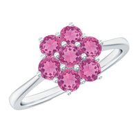 Round pink tourmaline flower engagement ring by Rosec Jewels featuring a floral design and silver band.