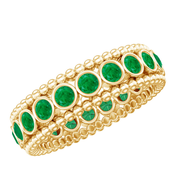 Vintage-inspired emerald wedding band in bezel setting, crafted by Rosec Jewels, featuring a detailed design on a silver ring.