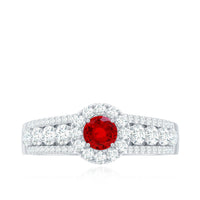 Lab created ruby side stone engagement ring with moissanite accents, featuring a silver band and intricate design.