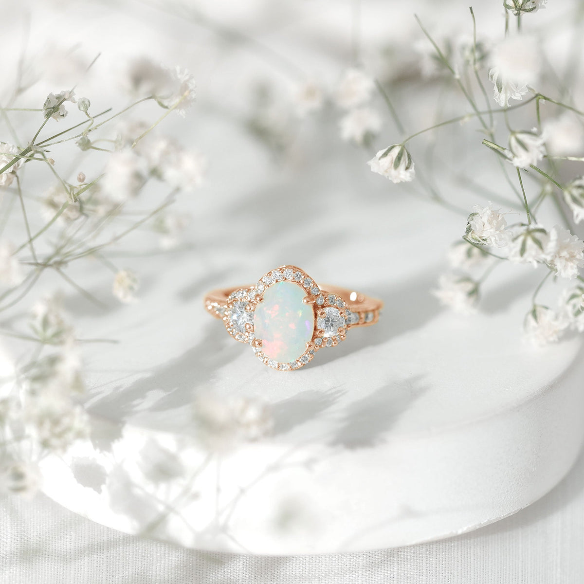 Vintage-inspired opalescent oval engagement ring with real diamond from Rosec Jewels, featuring a detailed metal band and elegant design.
