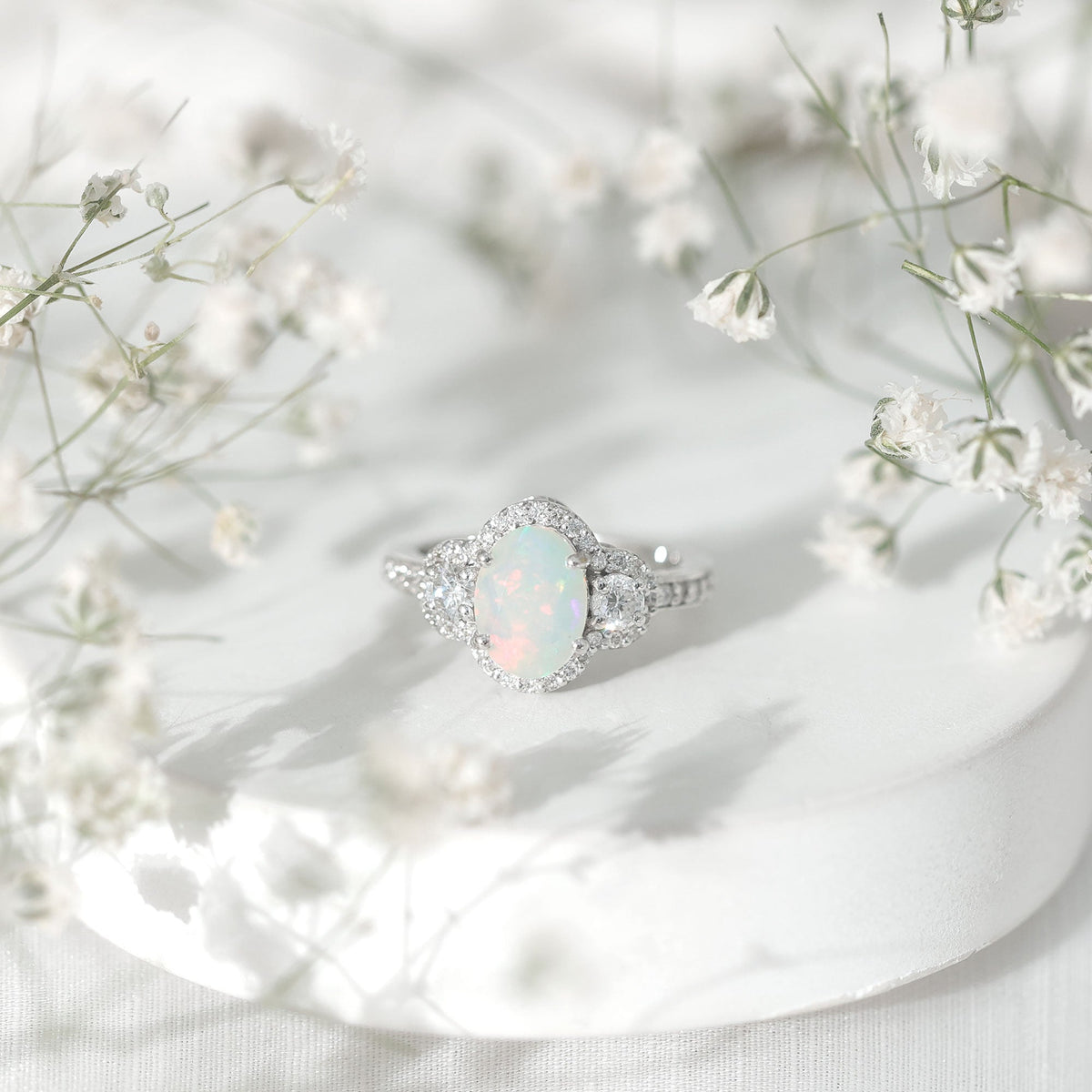 Vintage inspired opalescent oval engagement ring with real diamond from Rosec Jewels, showcasing a detailed gold band and sparkling gemstone.