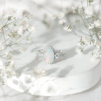 Vintage inspired opalescent oval engagement ring with real diamond from Rosec Jewels, showcasing a detailed gold band and sparkling gemstone.
