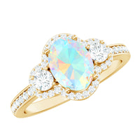 Vintage-inspired opalescent oval engagement ring with real diamond from Rosec Jewels featuring intricate metalwork and elegant design.