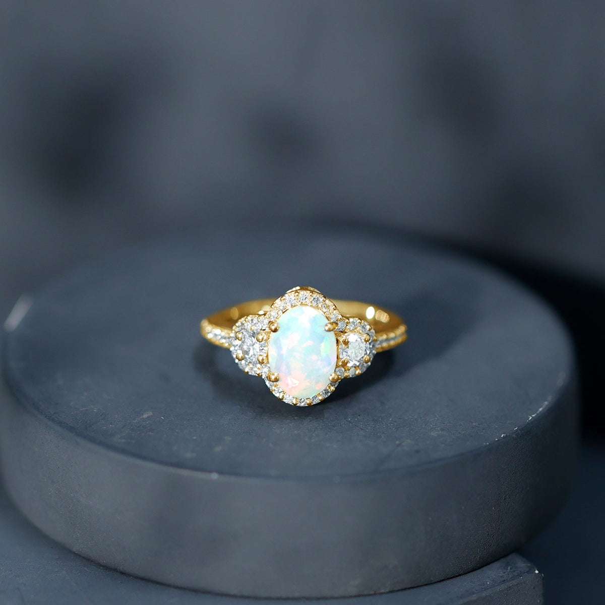 Vintage-inspired opalescent oval engagement ring with real diamond, featuring a rose gold band by Rosec Jewels.