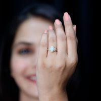 Vintage-inspired opalescent oval engagement ring with real diamond, featuring a Rosec Jewels elegant ring design.