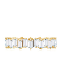 Rosec Jewels baguette-shaped moissanite eternity wedding band ring with alternating sparkling stones on a silver band.