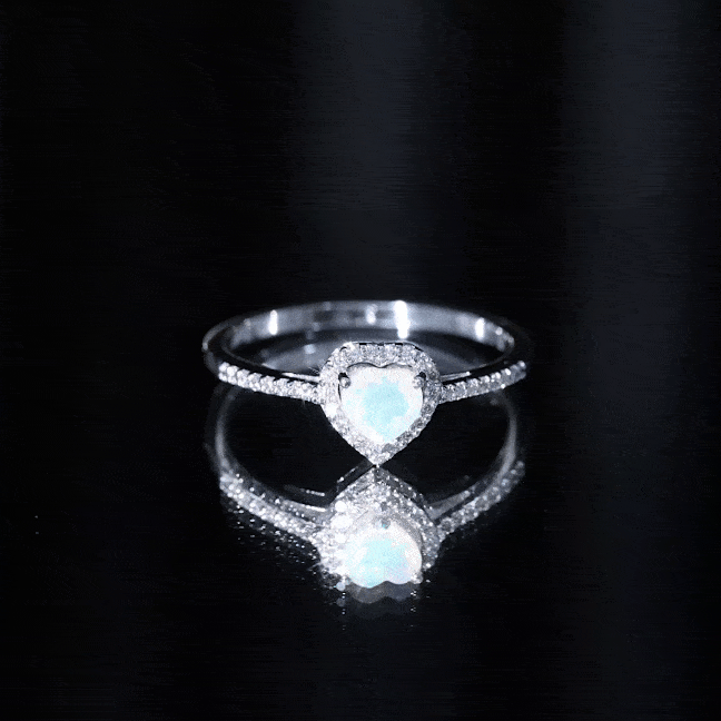 Heart-shaped engagement ring with natural Ethiopian opal and diamond halo, featuring a gold band by Rosec Jewels