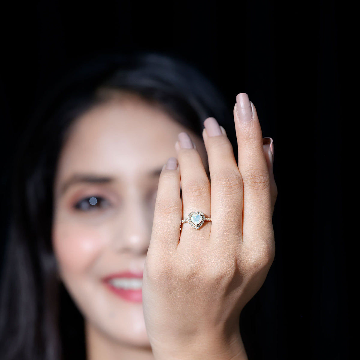Heart-shaped Ethiopian opal engagement ring with diamond halo by Rosec Jewels, featuring a vibrant natural gemstone and elegant design.