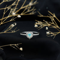 Heart-shaped natural Ethiopian opal engagement ring with diamond halo, featuring Rosec Jewels' elegant design and craftsmanship.