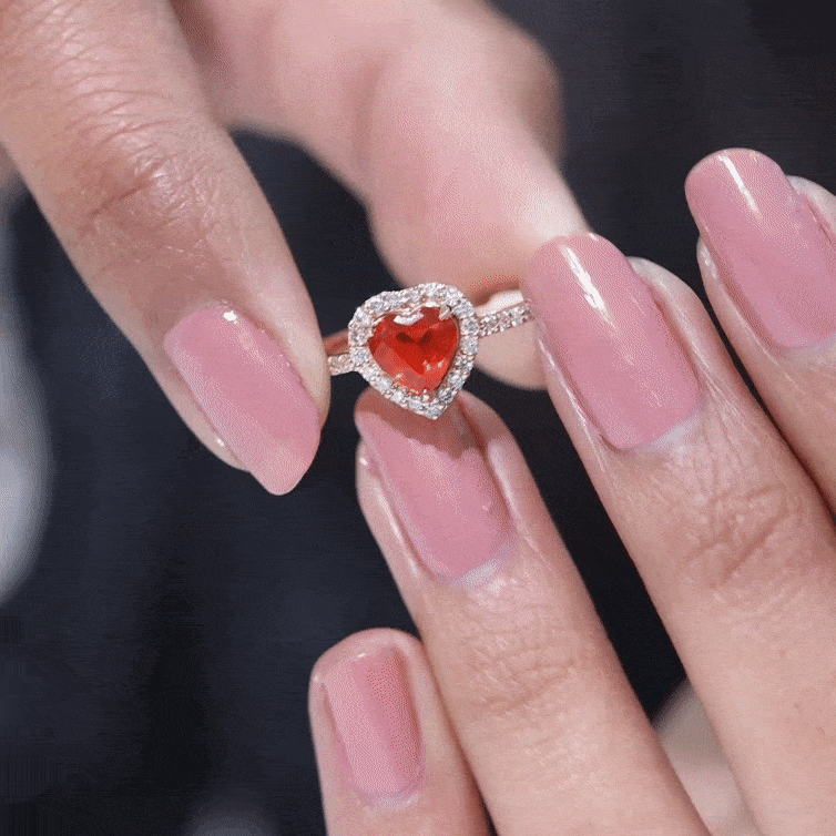 Heart-shaped fire opal engagement ring with diamond halo, 0.9 carats, from Rosec Jewels featuring a stunning gemstone setting.
