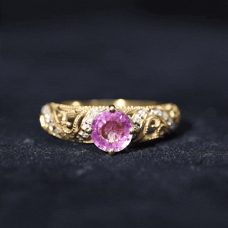 Lab-grown pink sapphire antique engagement ring with diamond accents from Rosec Jewels, featuring intricate vintage design and sparkling stones.