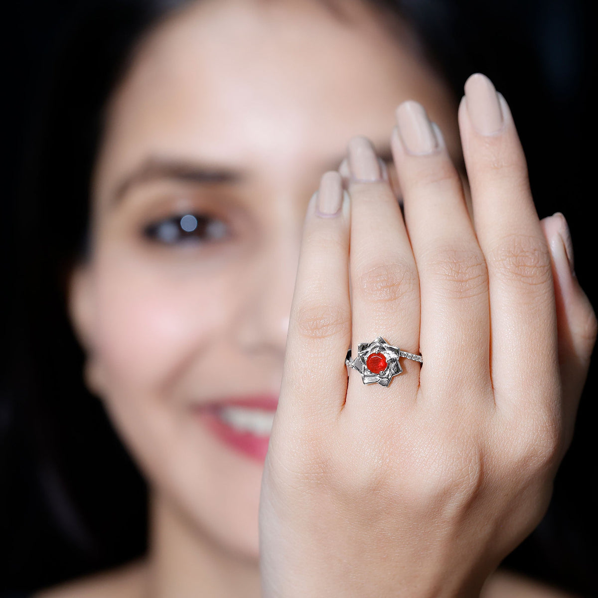 Flower-inspired fire opal engagement ring with diamonds by Rosec Jewels, showcasing a vibrant orange gemstone and delicate floral design.