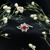 Flower-inspired Fire Opal engagement ring with diamond accents from Rosec Jewels, showcasing intricate floral design and sparkling gemstones.