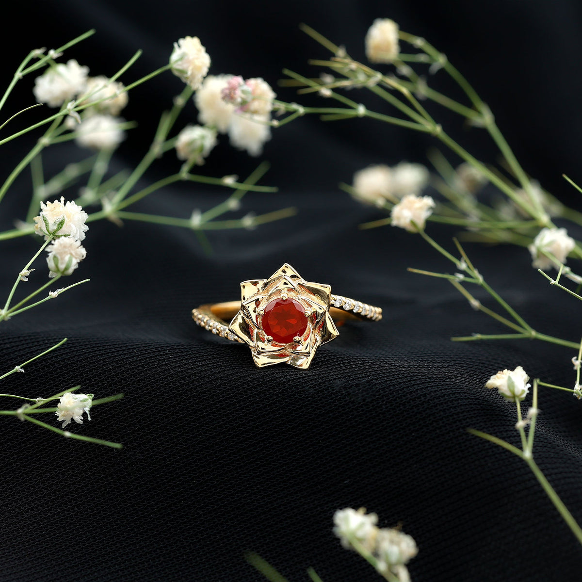 Flower-inspired fire opal engagement ring with diamond accents by Rosec Jewels, showcasing intricate floral design and sparkling gemstones.