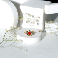 Flower-inspired fire opal engagement ring with diamond accents from Rosec Jewels featuring a vibrant fire opal centerpiece and intricate design.