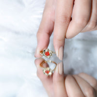 Flower-inspired fire opal engagement ring with diamonds from Rosec Jewels, featuring vibrant gemstone and intricate floral design.