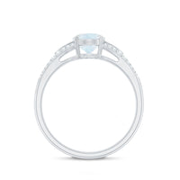 Oval cut moonstone solitaire engagement ring with diamond accents, featuring a 3/4 ct center stone, by Rosec Jewels.