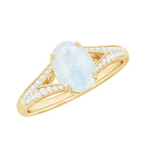 Oval cut moonstone solitaire engagement ring with diamond accents by Rosec Jewels, showcasing the elegant design and gemstone details.