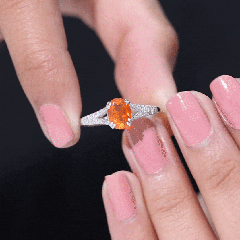 Oval 1 carat fire opal engagement ring with diamond split shank by Rosec Jewels, showcasing the vibrant gemstone and elegant design.