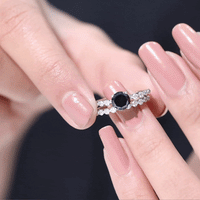 Round cut black onyx and diamond stacking wedding rings set by Rosec Jewels, featuring sleek black onyx and sparkling diamonds.