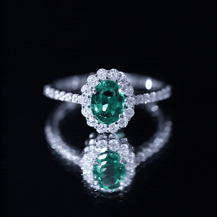 Oval lab-grown emerald halo engagement ring with diamond accents, set in a rose gold band from Rosec Jewels.