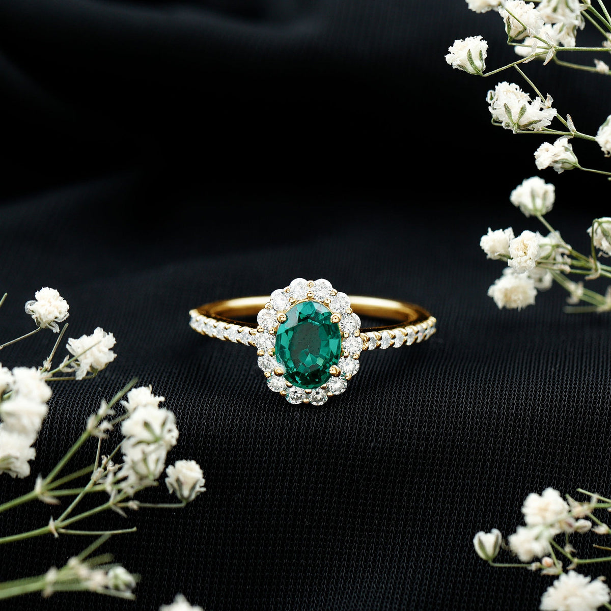 Oval lab-grown emerald halo engagement ring with diamond accents by Rosec Jewels, featuring a 1.2 carat center stone.