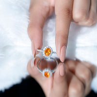 Oval orange fire opal engagement ring with Moissanite by Rosec Jewels, featuring a detailed silver band and vibrant gemstone.