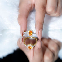 Orange fire opal oval engagement ring with moissanite accents by Rosec Jewels, showcasing a vibrant gemstone design.