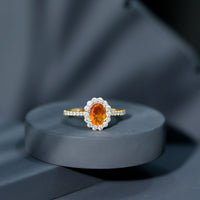 Orange fire opal oval engagement ring with moissanite accents from Rosec Jewels, showcasing a vibrant gemstone and elegant band.