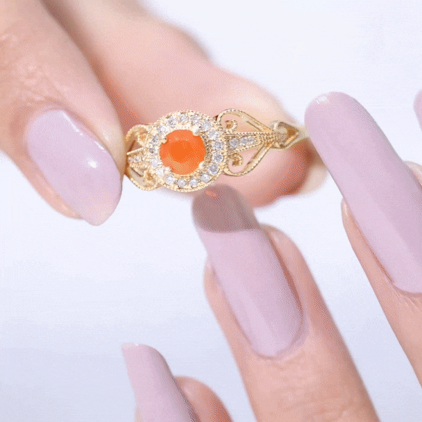 Vintage-inspired engagement ring featuring a 0.45-carat fire opal and diamonds, crafted by Rosec Jewels.